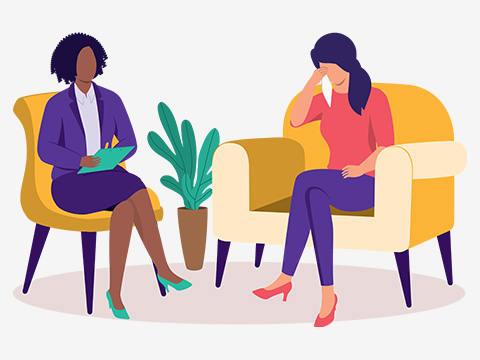 two women in a therapy session sitting in comfortable chairs discussing mental health emotional support and wellness strategies counsellor in Croydon